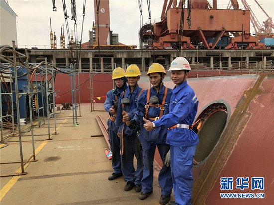 陈庆城(右一)和他的同事们。新华网发(李夏摄) 陈庆城(右一)和他的同事们。新华网发(李夏摄)