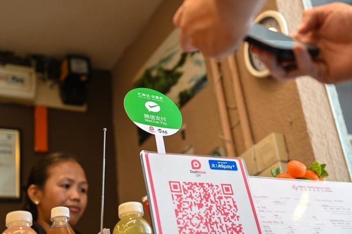 A local QR payment code accepting WeChat Pay and Alipay is seen at a restaurant in Kuala Lumpur, Malaysia, April 24, 2026. (Photo by Chong Voon Chung/Xinhua)