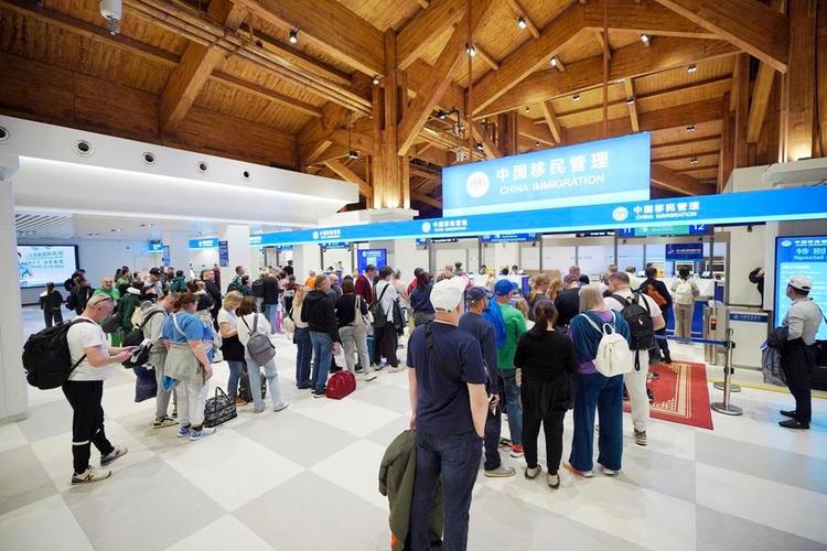 Inbound passengers line up for border procedures at Sanya Phoenix International Airport in Sanya, south China's Hainan Province, Dec. 18, 2025. (Photo by Meng Xushun/Xinhua)